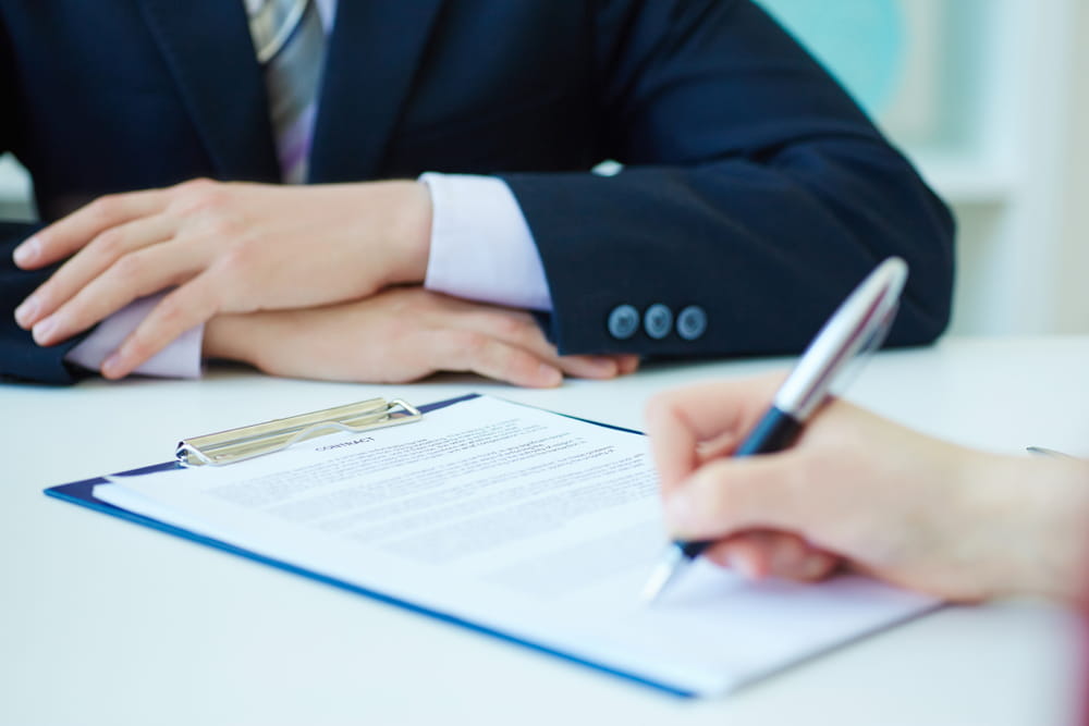 Attorney reviewing a Franchise Disclosure Document with prospective franchisee before signing agreement.