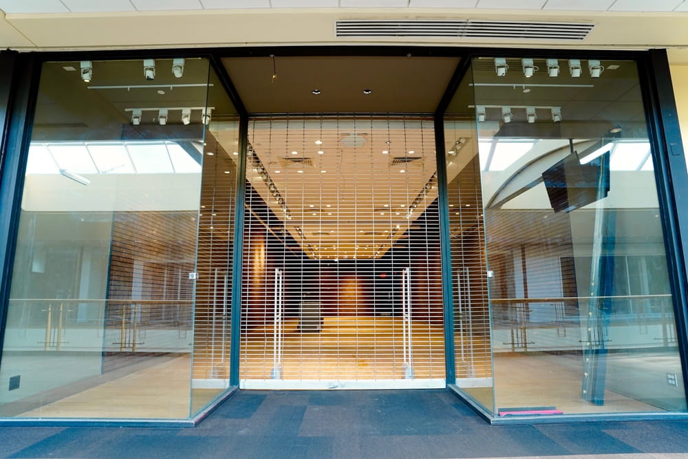 Closed storefront representing business restrictions from franchise non compete clause in Florida