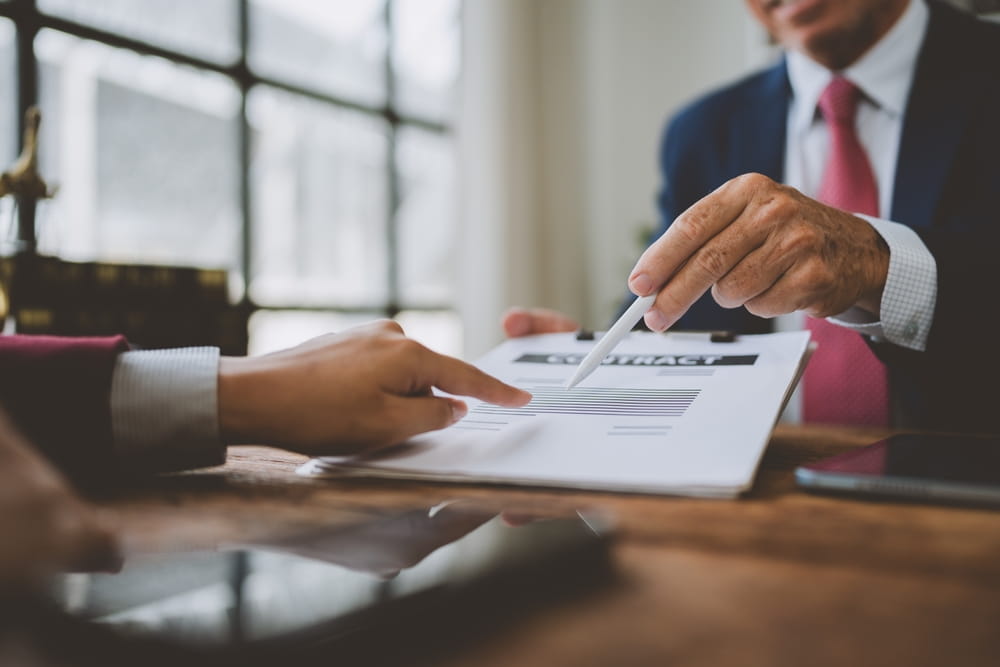 Attorney reviewing contract with client regarding franchise non compete clause in Florida