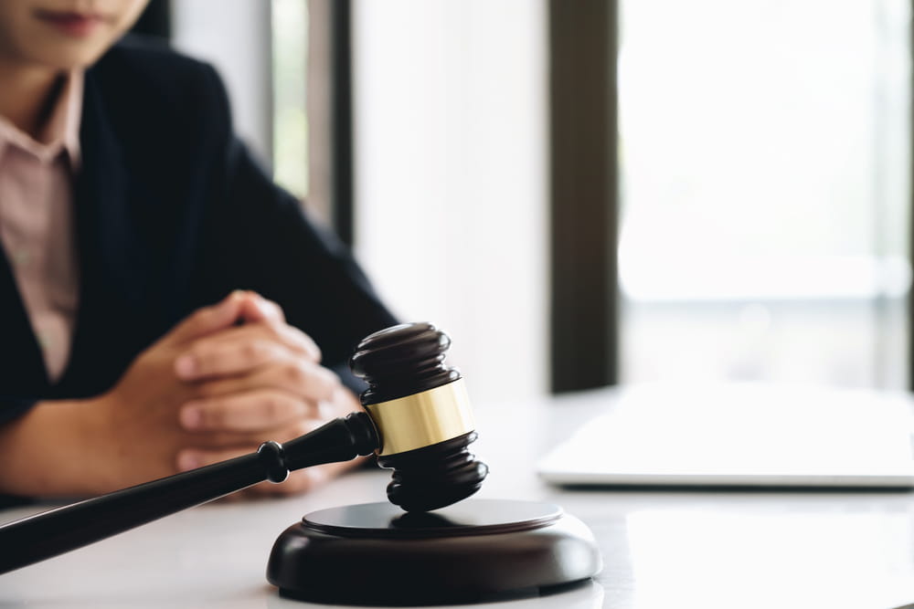 Gavel on desk representing legal enforcement of business contract terms