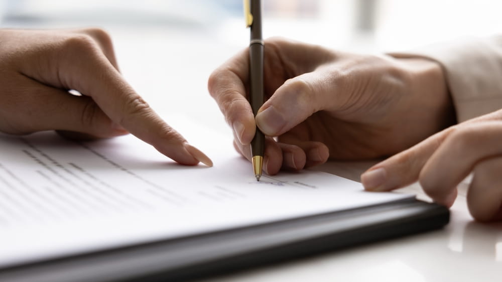 Signing a business contract agreement to formalize terms and obligations